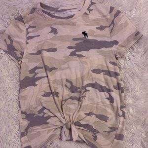 A camo shirt with a tie